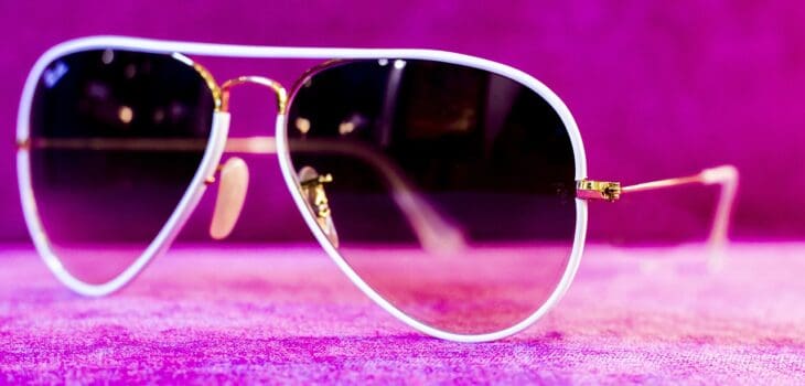 pink background, white sunglasses